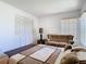 Bedroom featuring neutral tones, ample closet space, and natural light from a window at 11624 Peach Grove Ln, Orlando, FL 32821