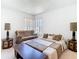 Cozy bedroom with a seating area, neutral colors, and a window with natural light at 11624 Peach Grove Ln, Orlando, FL 32821