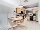 Bright dining area connects directly to kitchen for easy enjoyment and offers great natural lighting at 11624 Peach Grove Ln, Orlando, FL 32821