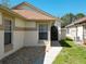 Well maintained front exterior with desert landscaping at 11624 Peach Grove Ln, Orlando, FL 32821