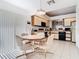 Bright eat-in kitchen with tan cabinets and recessed lighting at 11624 Peach Grove Ln, Orlando, FL 32821