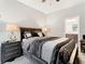 Comfortable main bedroom with a ceiling fan, nice furniture, and natural light at 11624 Peach Grove Ln, Orlando, FL 32821