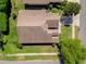 Birds eye view of home shows the backyard and trees in a suburban neighborhood at 124 Windsor Cresent St, Winter Springs, FL 32708