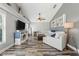 Comfortable living room with hardwood-style flooring, a modern fireplace, and a large sectional sofa at 124 Windsor Cresent St, Winter Springs, FL 32708