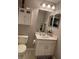 Bathroom featuring a toilet, vanity with storage, framed mirror and medicine cabinet above the toilet at 1247 Travertine Ter, Sanford, FL 32771