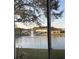 Water view with a fountain in a serene lake setting, as seen through a screened-in enclosure at 1247 Travertine Ter, Sanford, FL 32771