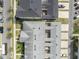 Overhead view of townhomes showcasing well-maintained landscaping, parking, and roof lines at 1312 Painted Bunting Ave, Oakland, FL 34787