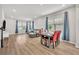 A bright dining area is connected to a living room with a view of the kitchen at 1312 Painted Bunting Ave, Oakland, FL 34787