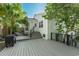 Inviting back deck area perfect for entertaining with an outdoor cooking area and convenient access to the home's entrance at 1407 E Kaley St, Orlando, FL 32806