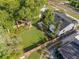 Overhead shot of a spacious backyard including lush garden and mature trees, creating a private outdoor retreat at 1407 E Kaley St, Orlando, FL 32806