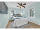 Serene bedroom with hardwood floors, ceiling fan, and two windows at 1407 E Kaley St, Orlando, FL 32806