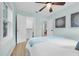 Bright bedroom with hardwood floors, large windows, and an open closet at 1407 E Kaley St, Orlando, FL 32806