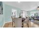 Dining room with hardwood floors adjacent to an open living area at 1407 E Kaley St, Orlando, FL 32806