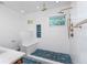 Contemporary bathroom featuring a large, tiled shower with a built-in bench and blue geometric tile flooring at 1432 W Yale St, Orlando, FL 32804