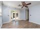 Light blue bedroom with wood-look tile flooring, ceiling fan, and french door access to patio at 1432 W Yale St, Orlando, FL 32804