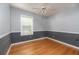 Neutral bedroom features stylish two tone paint and hardwood floors at 1432 W Yale St, Orlando, FL 32804