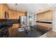 Well lit kitchen features stainless appliances, dark countertops and wood cabinets at 1432 W Yale St, Orlando, FL 32804