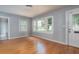 Cozy room with beautiful wood floors, a sunlit window, and fresh paint, creating a warm and inviting space at 1432 W Yale St, Orlando, FL 32804