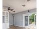 Versatile space featuring wood-look flooring, built-in shelving, French doors to the outside deck, and neutral wall color at 1432 W Yale St, Orlando, FL 32804