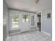 Sunroom with white tile and windows looking out at street at 1432 W Yale St, Orlando, FL 32804