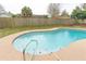 Backyard pool with tile accents, surrounded by concrete deck and a well-maintained fence at 1505 Guinevere Dr, Casselberry, FL 32707