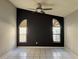 Bedroom with tile floors, high ceilings, and arched windows providing natural light at 1509 Jason St, Kissimmee, FL 34744