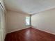 Bedroom with laminate floors, a window, and closet at 1509 Jason St, Kissimmee, FL 34744