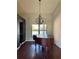 Elegant dining room with wood floors, chandelier, and natural light at 1509 Jason St, Kissimmee, FL 34744