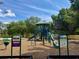 Community playground with slides, climbing structures, and safety signage for a welcoming and secure play environment at 1509 Jason St, Kissimmee, FL 34744