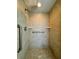 Shower with tile surround and accessible grab bars at 1509 Jason St, Kissimmee, FL 34744