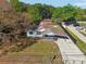 Aerial view of the home featuring the roof, yard and driveway at 1518 Coletta Dr, Orlando, FL 32807