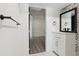 Modern bathroom with black fixtures, a mirror, a countertop with sink, and decorative black and white tile at 1518 Coletta Dr, Orlando, FL 32807