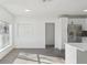 Bright living area with an adjacent kitchen and ample natural light from the windows at 1518 Coletta Dr, Orlando, FL 32807