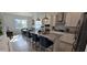 Modern kitchen with granite countertops, stainless steel appliances, and pendant lighting at 15742 Vetta Dr, Bella Collina, FL 34756