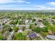 Scenic aerial view of single Gathering homes nestled among lush green trees at 1610 Stephanie Ln, Lakeland, FL 33813