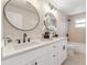 Modern bathroom featuring double vanity, large mirrors, and a bathtub-shower combination at 1610 Stephanie Ln, Lakeland, FL 33813