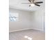 Bright bedroom featuring updated ceiling fan, light colored walls and wood-look flooring at 1610 Stephanie Ln, Lakeland, FL 33813