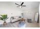 Cozy living room with a ceiling fan, neutral tones, and modern decor, creating an inviting space at 1610 Stephanie Ln, Lakeland, FL 33813