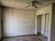 Empty bedroom featuring a ceiling fan and a closet at 1838 Windmill Dr, Orlando, FL 32818