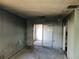 Open space with sliding glass doors leading to another room, ready for customization at 1838 Windmill Dr, Orlando, FL 32818