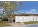 A clean white fence surrounds the back of a single story house at 209 Esplanade Way # 109, Casselberry, FL 32707