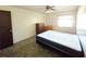 Bedroom with ceiling fan, window, and laminate flooring at 209 Esplanade Way # 109, Casselberry, FL 32707