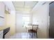 Bright kitchen area with a dining table and chairs next to a window at 209 Esplanade Way # 109, Casselberry, FL 32707