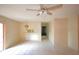 Spacious living room featuring tile flooring, a ceiling fan, and natural light at 209 Esplanade Way # 109, Casselberry, FL 32707