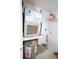 Functional utility room with water heater, and some storage shelving at 209 Esplanade Way # 109, Casselberry, FL 32707