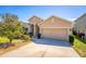 Inviting single-story home with a two-car garage and manicured landscaping at 2300 Natoma Blvd, Mount Dora, FL 32757