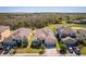 Aerial view displays a single-Gathering home with manicured lawn, adjacent to neighboring residences at 2300 Natoma Blvd, Mount Dora, FL 32757