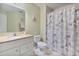 Bathroom showcasing a vanity, toilet, and shower with Paris-themed curtain at 2864 Polana St # 104, Orlando, FL 32835