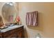 Close up of a well-maintained bathroom with marble countertop vanity and brushed chrome faucet at 2864 Polana St # 104, Orlando, FL 32835