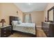 Cozy bedroom with ample natural light and wood-look floors at 2864 Polana St # 104, Orlando, FL 32835